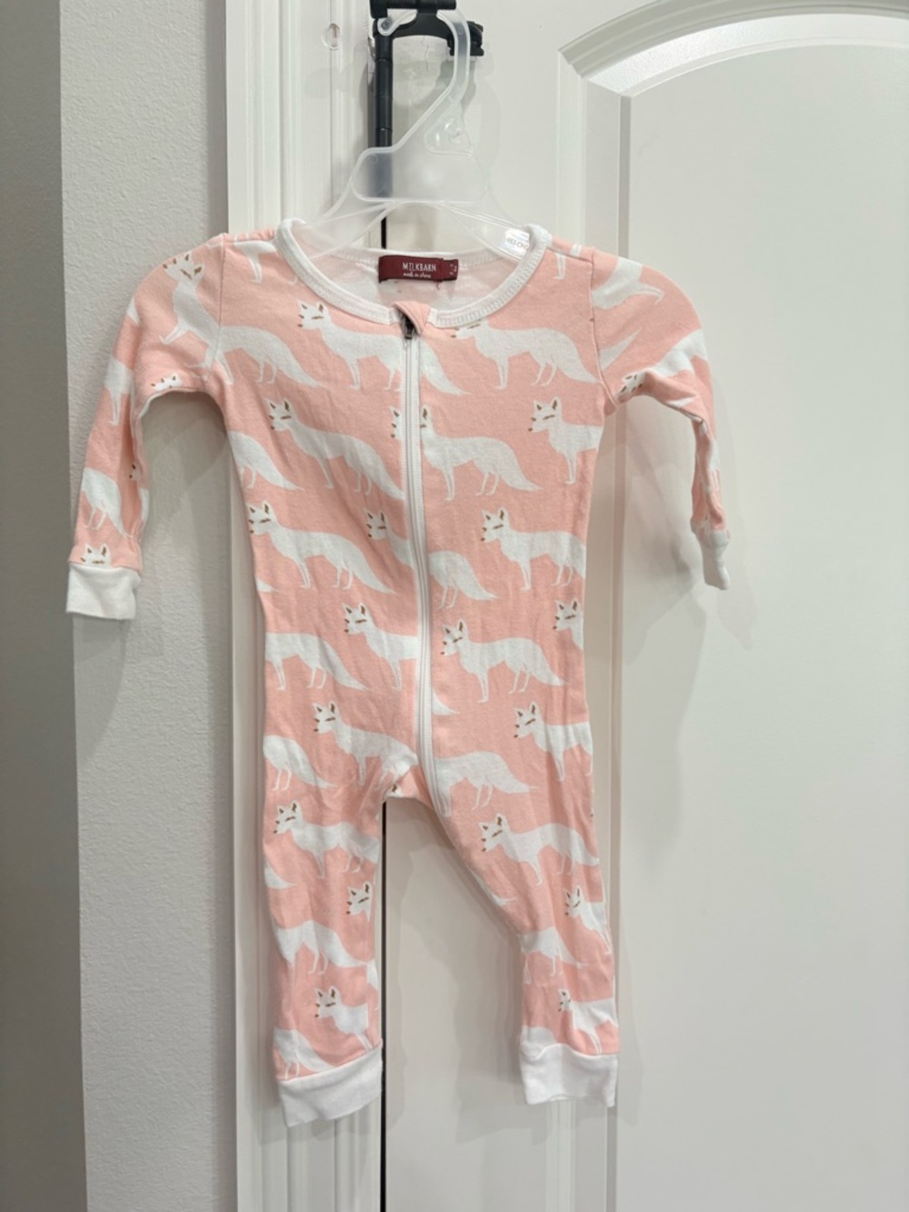 Milkbarn pink with white foxes zip front footless pajama in 6-9 months GUC